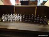 AVON BOTTLES IN THE FORM OF CHESS PIECES SET TO INCLUDE 16 PAWNS, 4 ROOKS, 4 KNIGHTS, 4 BISHOPS, AND