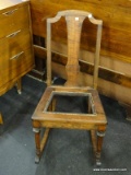 VINTAGE ROCKING CHAIR WITH SPACE FOR A CANE BOTTOM SEAT. MEASURES 14 IN X 29 IN X 33 IN. ITEM IS