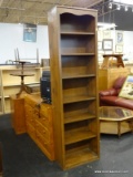 6 SHELF MAHOGANY BOOKCASE. MEASURES 24 IN X 12 IN X 84 IN. ITEM IS SOLD AS IS WHERE IS WITH NO