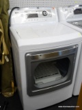 LG TRUE STEAM DRYER WITH SMART DIAGNOSIS. HAS A DIGITAL DISPLAY AND MEASURES 27 IN X 27 IN X 45 IN.