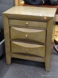 MODERN NIGHT STAND WITH 3 DRAWERS AND PEWTER FINISH PULLS. MEASURES 23 IN X 17 IN X 28 IN. SOLD AS