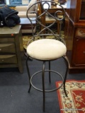 SWIVEL BAR STOOL WITH WROUGHT IRON BACK AND TAN UPHOLSTERED SEAT. MEASURES 18 IN X 19 IN X 47 IN.