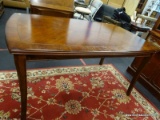 CHERRY DINING TABLE WITH SABRE LEGS AND BANDED TOP. MEASURES 36 IN X 60 IN X 30 IN. ITEM IS SOLD AS