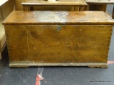 PINE DOVETAILED FOOTLOCKER WITH INTERIOR TRAY ON THE LEFT SIDE. MEASURES 38 IN X 16 IN X 18 IN. HAS