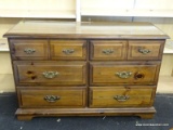 6 DRAWER PINE DRESSER WITH BRASS CHIPPENDALE STYLE PULLS. MEASURES 50 IN X 18 IN X 32 IN. ITEM IS