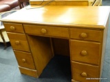 MAPLE DOUBLE PEDESTAL DESK WITH MAPLE KNOB STYLE PULLS. HAS 3 DRAWERS ON EITHER SIDE AND 1 CENTER