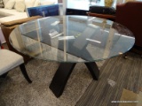 MODERN ROUND DINING TABLE WITH ESPRESSO COLORED LEGS AND A TEMPERED GLASS TOP. MEASURES 54 IN X 31