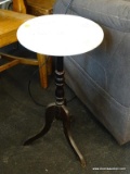 ROUND MARBLE TOP END TABLE WITH MAHOGANY BASE. MEASURES 12 IN X 23 IN. SOLD AS IS, WHERE IS, WITH NO