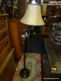 FLOOR LAMP WITH ADJUSTABLE ARM, TAN SHADE AND BALL STYLE FINIAL. MEASURES 60 IN TALL. SOLD AS IS,