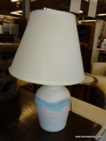 MULTI-COLOR TABLE LAMP WITH CONE STYLE SHADE AND BRASS FINIAL. MEASURES 22 IN TALL. SOLD AS IS,