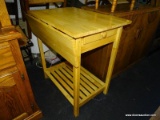 MAPLE KITCHEN ISLAND WITH DROP SIDE, 1 DRAWER, AND LOWER SLATTED SHELF. MEASURES 23 IN X 32 IN X 34