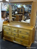 7 DRAWER DRESSER WITH DENTIL MOLDING TOP AND BRASS CHIPPENDALE STYLE PULLS. MEASURES 52 IN X 18 IN X