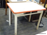 WHITE AND RED TABLE WITH OPENING FOR A DRAWER AND A PORCELAIN TOP. MEASURES 36 IN X 25 IN X 30 IN.