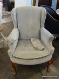 MAHOGANY QUEEN ANNE WING CHAIR WITH ROLLED ARMS, BLUE UPHOLSTERY, AND A BUTTON TUFTED SEAT. MEASURES