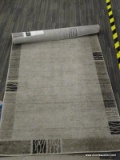 LOFT COLLECTION AREA RUG IN BLACK AND GRAY. MEASURES 3 FT 3 IN X 5 FT 3 IN. SOLD AS IS, WHERE IS,