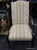 MARTHA WASHINGTON CHAIR WITH GREEN, CREAM, AND ORANGE UPHOLSTERY WITH MAHOGANY BONES AND BRASS