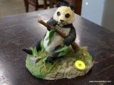 CROWN STAFFORDSHIRE FIGURINE OF A PANDA. MEASURES 5 IN X 4.5 IN X 5 IN. ITEM IS SOLD AS IS WHERE IS
