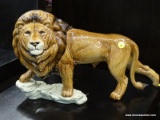 GOEBEL FIGURINE OF A LION. #36 019 25. MEASURES 20 IN X 6 IN X 10.5 IN. ITEM IS SOLD AS IS WHERE IS