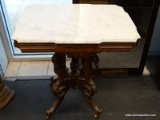 VICTORIAN MARBLE TOP END TABLE WITH WHITE MARBLE TOP AND WALNUT BASE. IS ON CASTERS FOR EASY