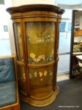 OAK CURIO CABINET WITH 2 SIDE DOORS, 3 INTERIOR GLASS SHELVES, AND CURVED GLASS PANELS. MEASURES 40