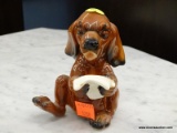 GOEBEL FIGURINE OF A DOG SINGING. #33 135. MEASURES 4.5 IN. ITEM IS SOLD AS IS WHERE IS WITH NO