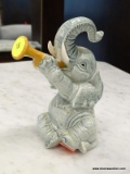 GOEBEL FIGURINE OF A ELEPHANT PLAYING TRUMPET. #133 131. MEASURES 5.5 IN TALL. ITEM IS SOLD AS IS