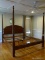 (BED 1) HARDEN FURNITURE CO. 4 POSTER KING SIZE BED WITH WOODEN RAILS AND METAL SLAT SUPPORTS.