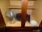 (BAS) CABINET LOT OF ASSORTED ITEMS TO INCLUDE 2 METAL ICE BUCKETS, A PIZZA BAKING PAN, ALUMINUM