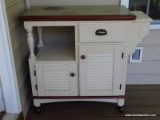 (BCK PRCH) ROLLING TEA CART WITH WHITE BODY AND MAHOGANY TOP. HAS 1 DRAWER OVER 1 DOOR WITH A SIDE