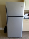 (GAR) FRIGIDAIRE REFRIGERATOR IN BLACK WITH STAINLESS DOORS. IS IN WORKING CONDITION. MEASURES 30 IN