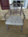 (FRNT PRCH) METAL OUTDOOR ARM CHAIR WITH GREEN UPHOLSTERED SEAT CUSHION. MEASURES 24 IN X 25 IN X 36