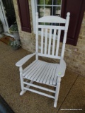 (FRNT PRCH) WHITE SLAT BOTTOM ROCKING CHAIR. MEASURES 26 IN X 34 IN X 48 IN. ITEM IS SOLD AS IS