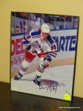(BAS) FRAMED AND AUTOGRAPHED PHOTO OF WAYNE GRETZKY. IS IN A BLACK FRAME AND MEASURES 8.25 IN X