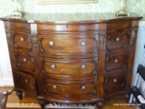 (DR) MAHOGANY BUFFET WITH 3 DRAWERS ON EITHER SIDE AND 4 CENTER DRAWERS. HAS ACANTHUS LEAF CARVED