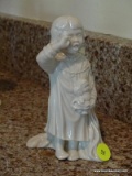 (FAM) LENOX FIGURINE OF A YOUNG CHILD WITH A DOLL YAWNING. MEASURES 6.5 IN TALL. ITEM IS SOLD AS IS