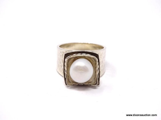 .925 STERLING SILVER FLOWER DESIGNED RING WITH HAMMERED SIDES & CENTER FAUX. PEARL. MARKED ON THE