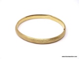 VINTAGE 14K YELLOW GOLD BANGLE BRACELET. MARKED ON THE ON THE CLASP. WEIGHS APPROX. 7.15 GRAMS. DOES
