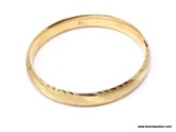 14K YELLOW GOLD BANGLE BRACELET. MARKED ON THE INSIDE. WEIGHS APPROX. 13.80 GRAMS.