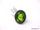 GERMAN SILVER & PERIDOT GEMSTONE RING. THE RING SIZE IS 7.