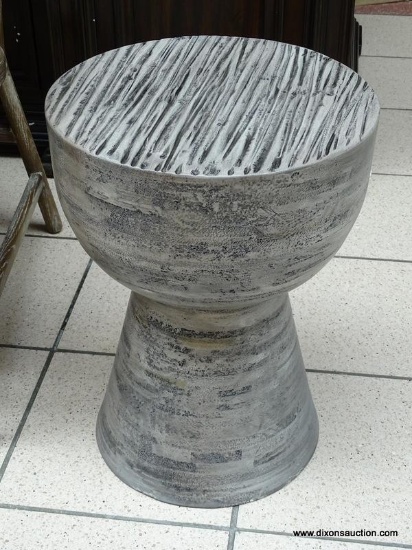 HOURGLASS OUTDOOR STOOL IN GRAY. THIS OUTDOOR STOOL IS MADE OF A HIGH-QUALITY CONCRETE AND FIBER