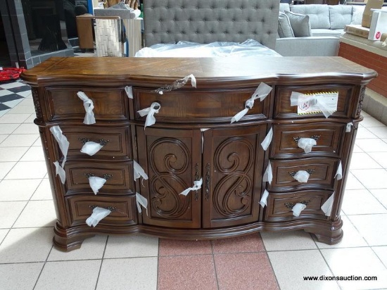 9 DRAWER AND 2 DOOR DRESSER WITH SCROLL CARVINGS FROM THE ROYALE COLLECTION BY STEVE SILVER. THIS