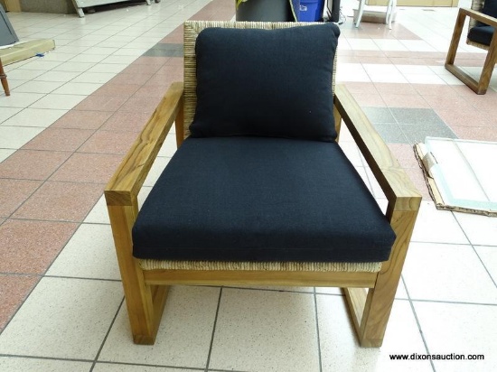 WOVEN SEAGRASS SEAT AND BACK ARM CHAIR WITH BLACK UPHOLSTERED CUSHION AND PILLOW. IS 1 OF A PAIR.