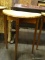CYPRESS WOOD DEMILUNE TABLE. MEASURES 23 IN X 12 IN X 29 IN. ITEM IS SOLD AS IS WHERE IS WITH NO