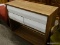 4 WHITE DRAWER SERVER WITH LOWER OPEN STORAGE AREA. MEASURES 40 IN X 16 IN X 34.5 IN. ITEM IS SOLD