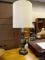 BRASS URN STYLE TABLE LAMP WITH CYLINDRICAL SHADE. MEASURES 38 IN TALL. ITEM IS SOLD AS IS WHERE IS