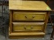 WOOD FINISH NIGHTSTAND WITH 2 DRAWERS WITH BRASS PULLS. MEASURES 25 IN X 15 IN X 22.5 IN. ITEM IS