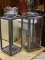 PAIR OF TIN LANTERNS WITH ROPE HANDLES. BOTH MEASURE 8.5 IN X 8.5 IN X 20.5 IN. 1 IS MISSING THE
