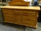 BROYHILL PINE MIRRORED 7 DRAWER AND 1 DOOR DRESSER. MEASURES APPROXIMATELY 70 IN X 19 IN X 80.5 IN.