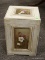 CREAM COLORED STORAGE BOX WITH FLORAL PAINTED PANELS AND FELT LINED INTERIOR. MEASURES 13 IN X 13 IN