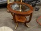 OVAL MAHOGANY END TABLE WITH CUT GLASS CENTER, BANDED TOP, REEDED LEGS WITH BRASS ACCENTS, AND A